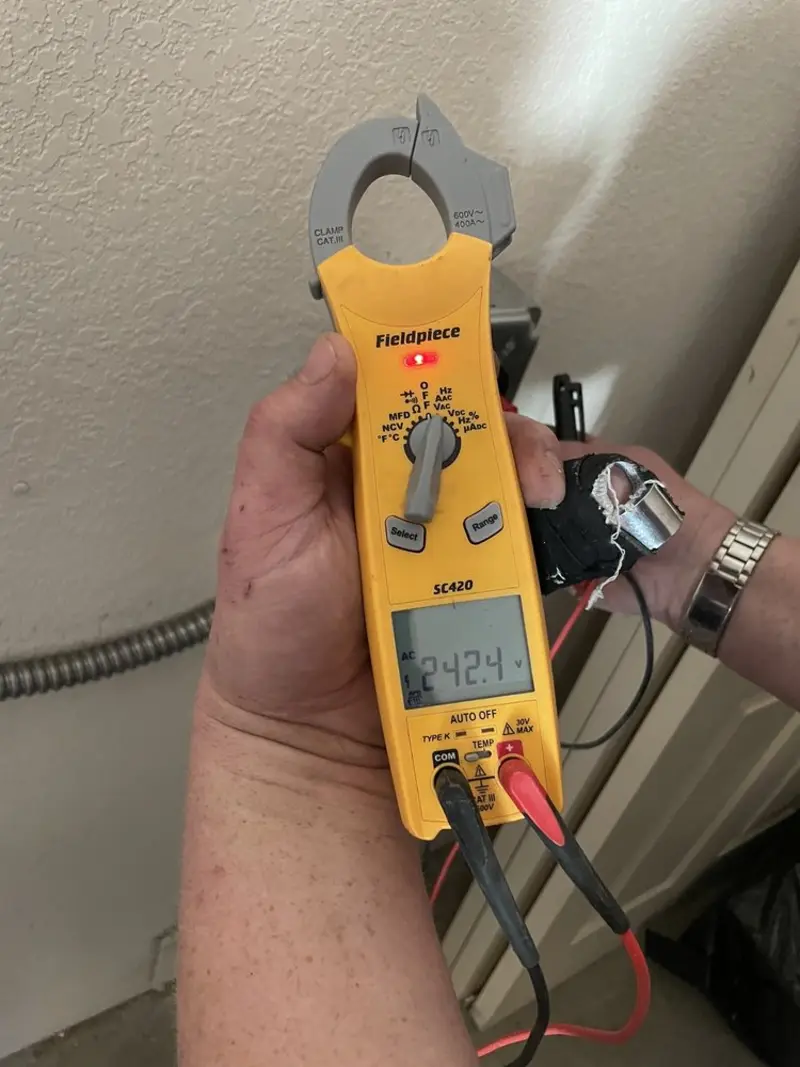 Voltage testing with clamp meter during Circuit Breaker Repair in Greene
